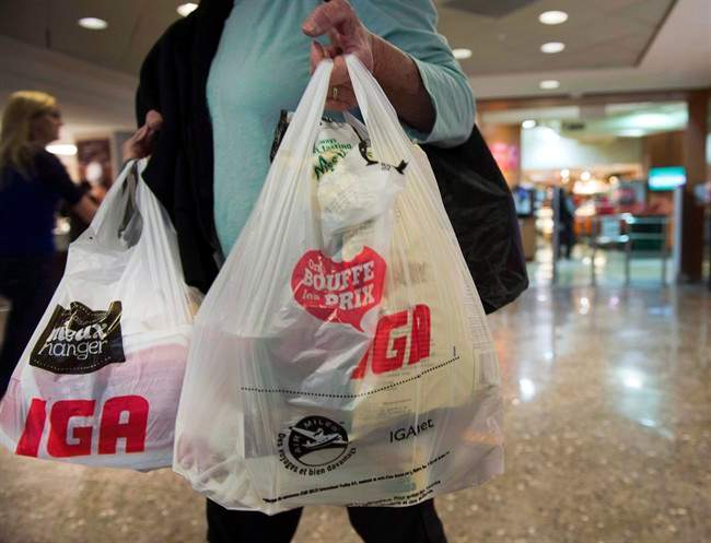A woman leaves a grocery store Friday, May 15, 2015 in Montreal. 