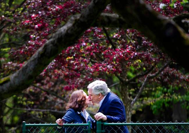Conrad Black, right, kisses his wife Barbara Amiel Black as he arrives at his Bridle Path residence in Toronto on Friday, May 4, 2012. Former press baron Conrad Black is looking to sell his 23,000-square-foot home in Toronto's exclusive Bridle Path neighbourhood. Nestled on a 6.6-acre lot, the nine-bedroom property that includes a caretaker suite and a converted coach house will hit the auction block on March 8.