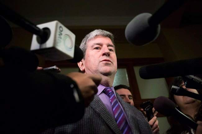Glen Murray talks to media at Queens Park in Toronto on Thursday, December 12 2013. 