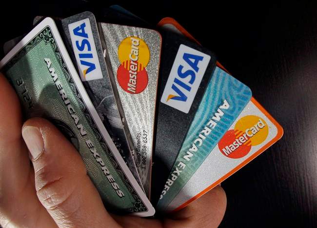 A Toronto man formerly from Kingston is facing a number of charges after police say he stole customer's credit and debit card information while working in a Kingston restaurant.