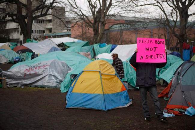 Residence of a homeless camp are shown in Victoria on Monday, January 11, 2016. 