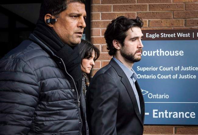 Marco Muzzo, right, leaves the Newmarket courthouse surrounded by family, on February 4, 2016. A sentencing hearing is scheduled today for the 29-year-old who pled guilty to driving drunk and causing a horrific crash that killed three children and their grandfather.