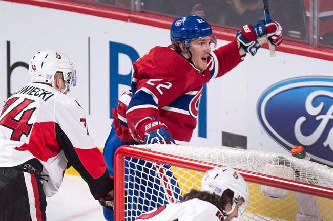 Montreal Canadiens' Dale Weise, right, celebrates his power-play goal against the Ottawa Senators.