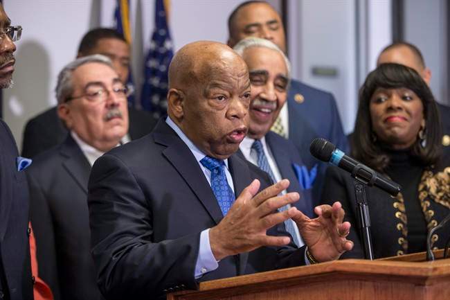 Rep. John Lewis, D-Ga., a leader of the civil rights movement, joins the Congressional Black Caucus Political Action Committee in endorsing Democratic Presidential candidate Hillary Clinton as prominent African-American Democrats rush to her aid ahead of the Feb. 27 Democratic primary in South Carolina, Thursday, Feb. 11, 2016, during a news conference on Capitol Hill in Washington.
