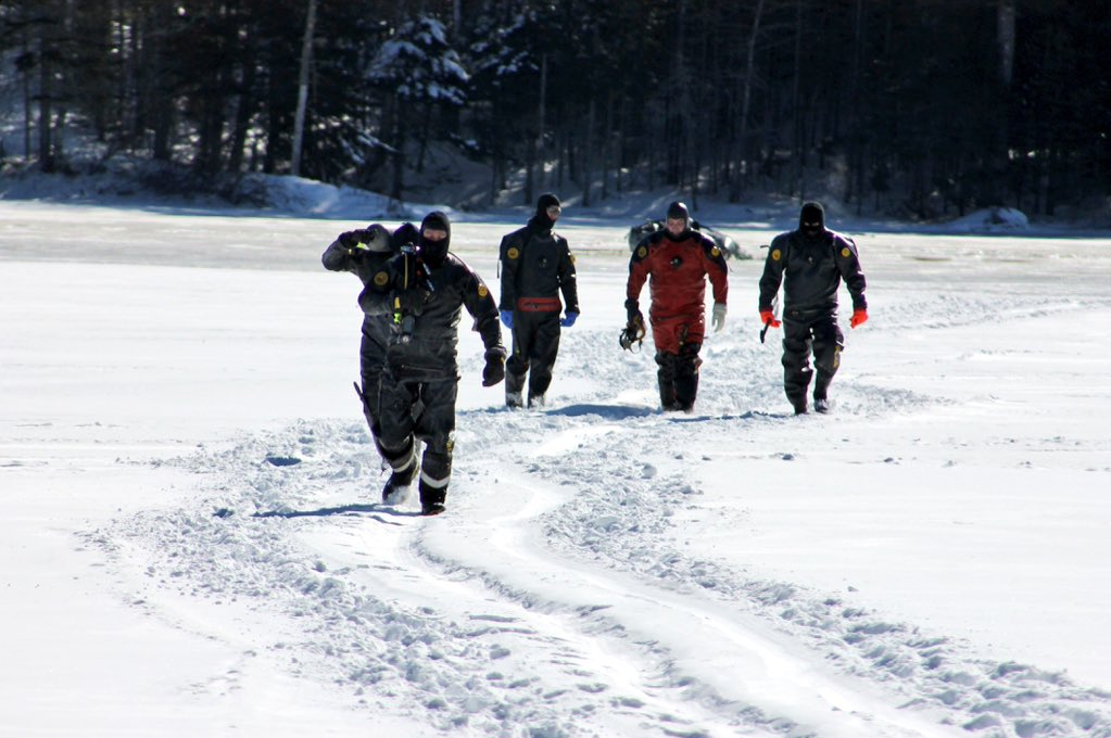 RCMP Underwater Recovery Team gets ready to search a section of Black River Lake on Monday for a missing 26-year-old man.