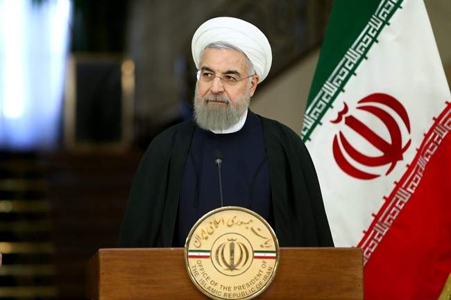 Iranian President Hassan Rouhani speaks with media in a joint press conference with Swiss President Johann Schneider after their meeting at the Saadabad Palace in Tehran, Iran, Saturday, Feb. 27, 2016.
