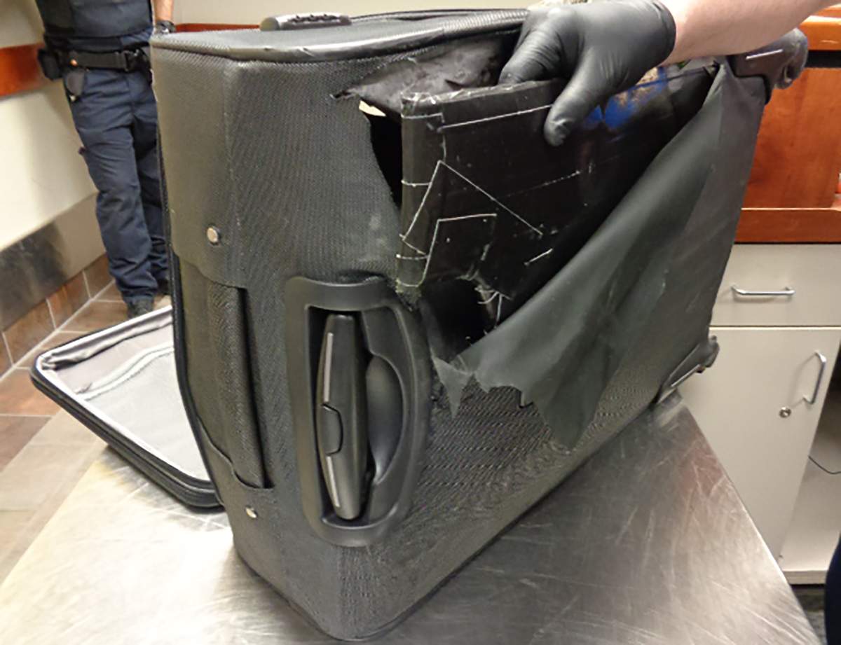 The package of suspected heroine was inside of a suitcase. 