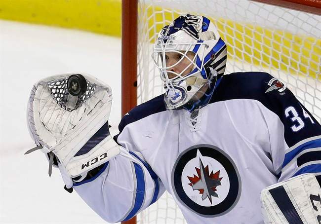 Goalie Michael Hutchinson was one of 13 players re-assigned by the Winnipeg Jets on Sunday.
