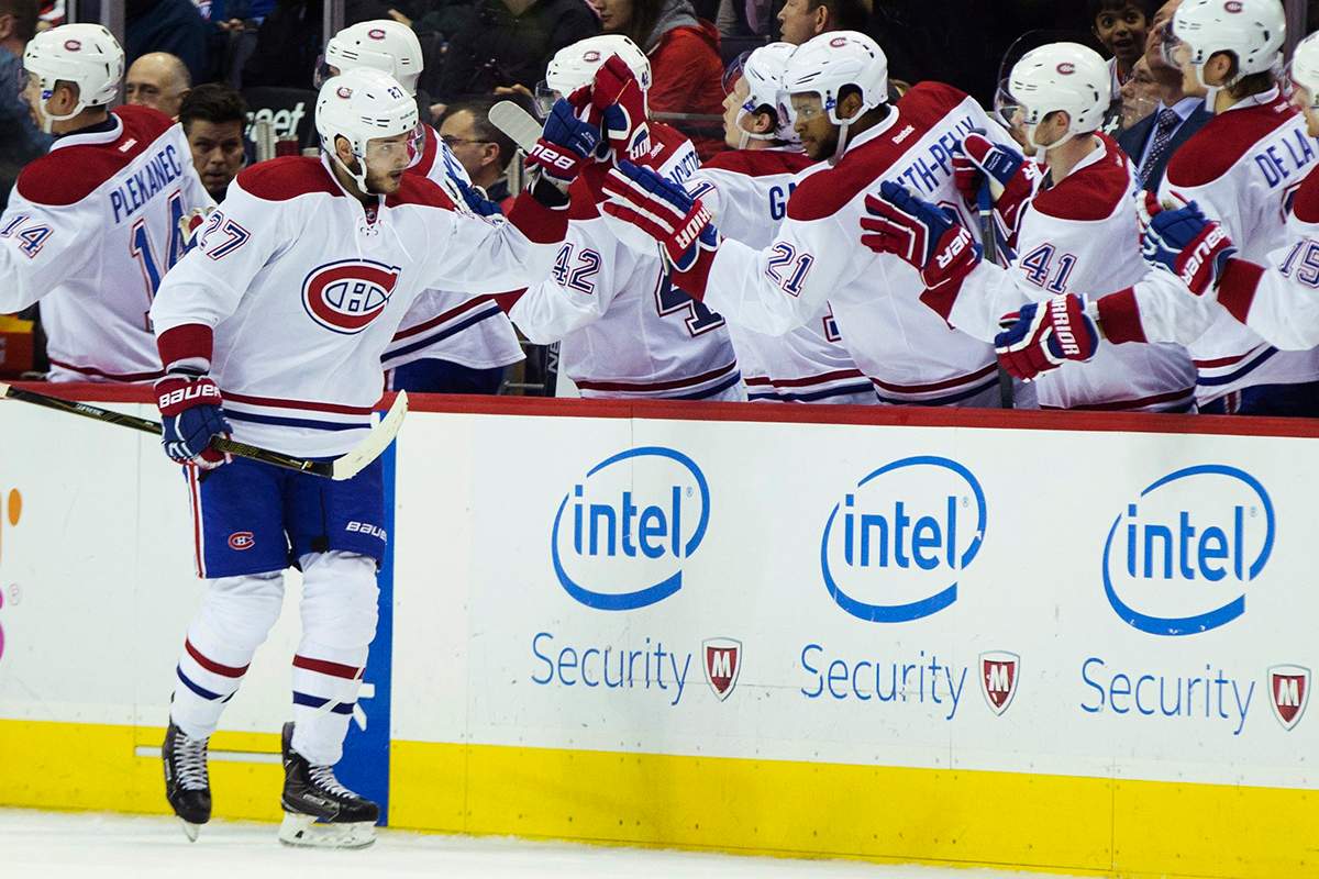 Montreal Canadiens center Alex Galchenyuk (27) is congratulated by teammates after scoring a second period goal against the Washington Capitals during an NHL hockey game, on Wednesday, Feb. 24, 2016, in Washington. 