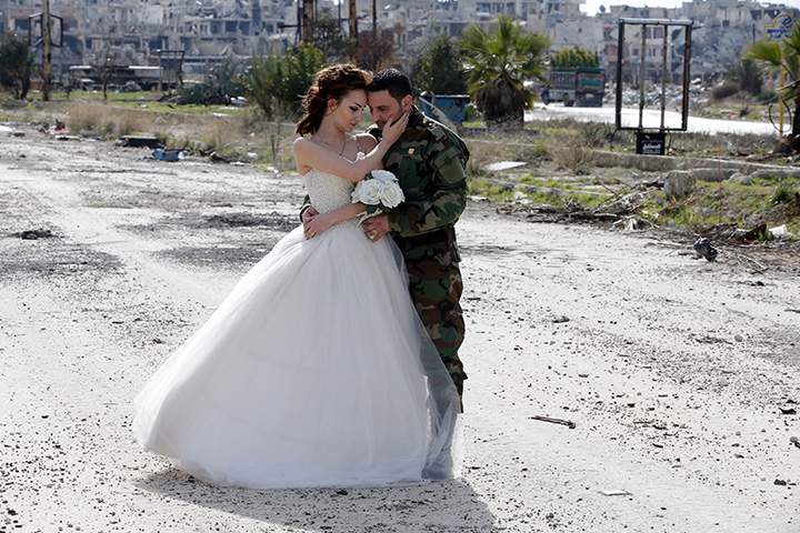 IN PHOTOS: Newlywed Syrian couple pose for wedding pictures amid ruins of war-ravaged city of Homs - image