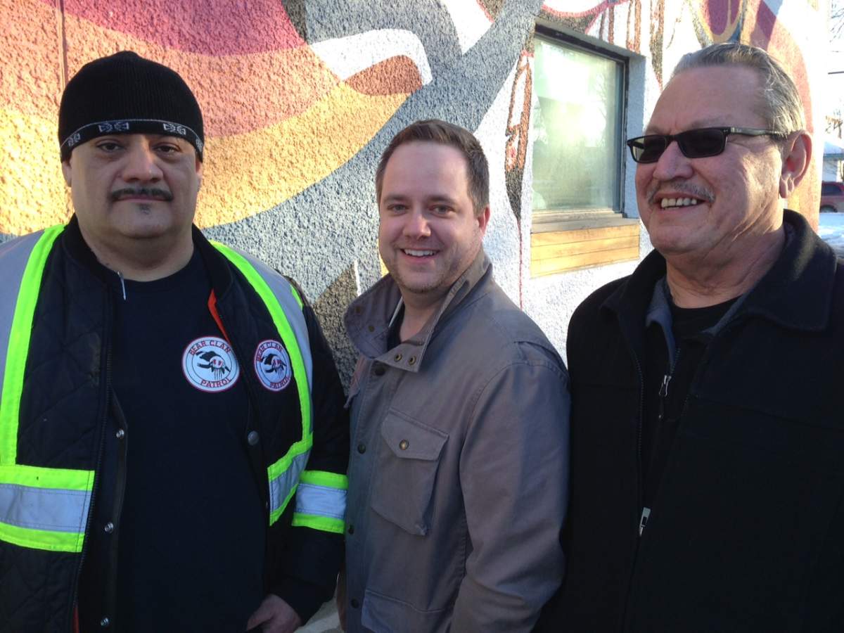 James Favel of Bear Clan Patrol, Brent Sayles, Cooper Nemeth's uncle and Larry Morrissette, elder gather for a meal.
