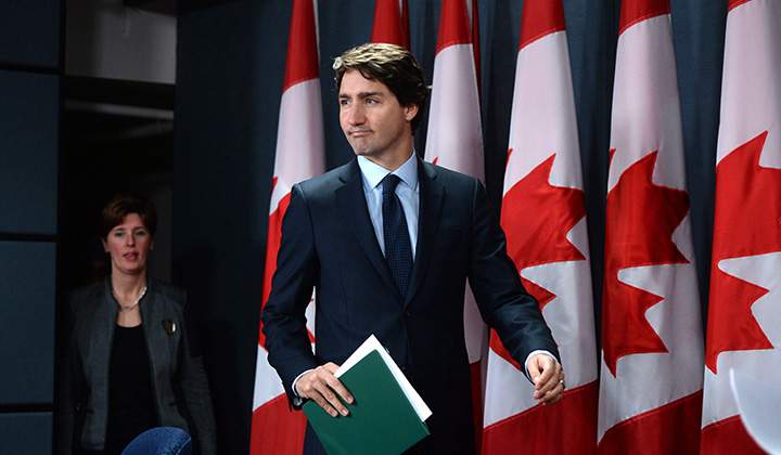 Prime Minister Justin Trudeau arrives at a press conference at the National Press Theatre in Ottawa on Monday, Feb. 8, 2016. 