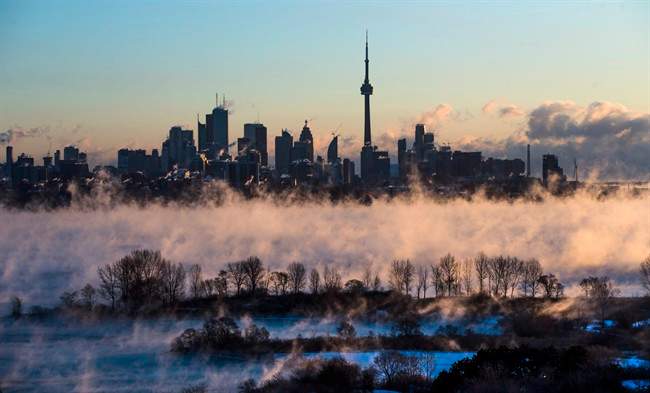 Steam rises from Lake Ontario in front of the skyline during extreme cold weather in Toronto on Saturday, February 13, 2016.