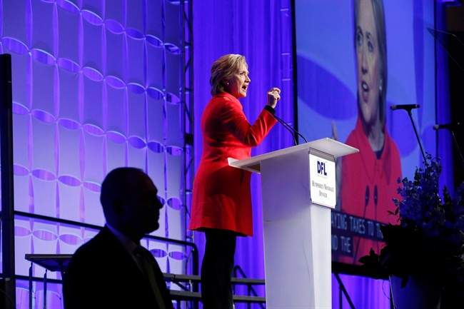 Democratic presidential candidate, Hillary Clinton acknowledges the crowd as she arrives to speak at the state's Democratic-Farmer-Labor (DFL) Humphrey-Mondale dinner, Friday, Feb. 12, 2016, in St. Paul, Minn.