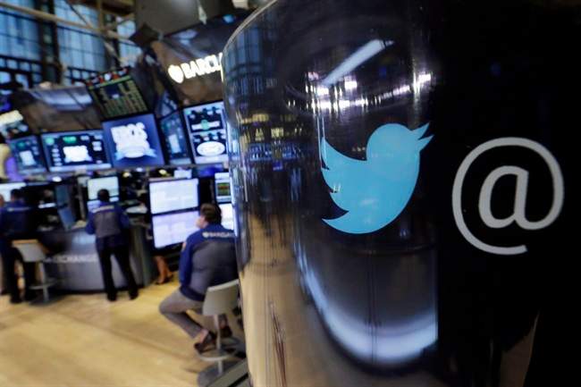  In this Tuesday, Oct. 13, 2015, file photo, the Twitter logo appears on a phone post on the floor of the New York Stock Exchange. Twitter Inc. reports financial results Wednesday, Feb. 10, 2016.