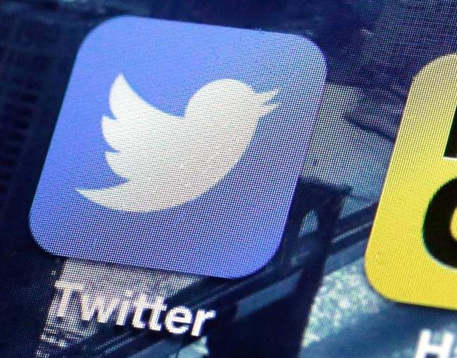 This Friday, Oct. 18, 2013, file photo, shows a Twitter app on an iPhone screen, in New York. 