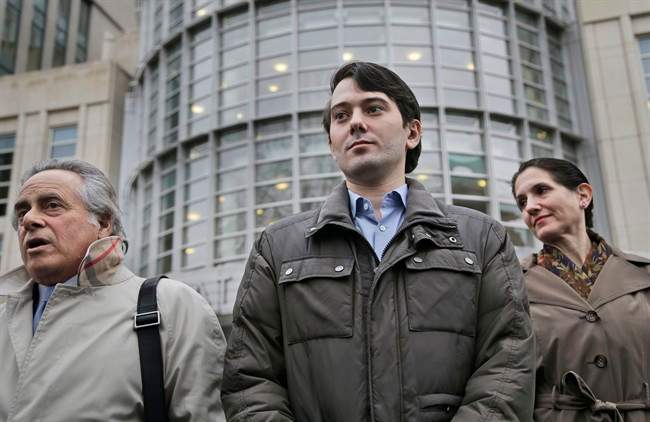 Former Turing Pharmaceuticals CEO Martin Shkreli, center, listens as his lawyer Benjamin Brafman, left, speaks to reporters as they leave court in New York, Wednesday, Feb. 3, 2016.