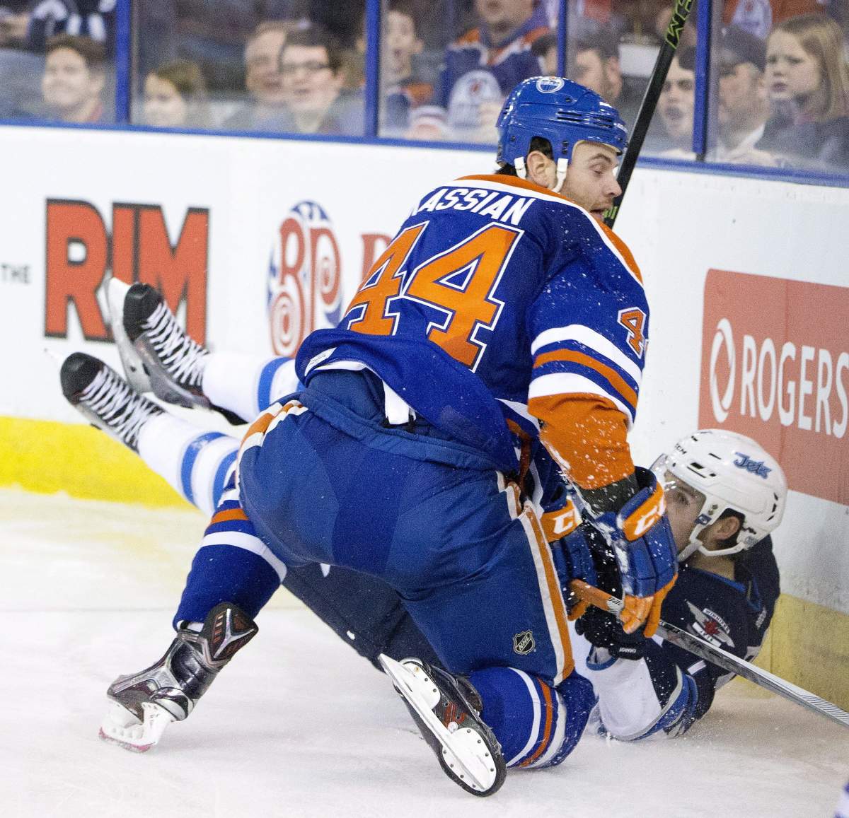 Winnipeg Jets' Ben Chiarot (7) is checked by Edmonton Oilers' Zack Kassian (44) during second period NHL action in Edmonton, Alta., on Saturday February 13, 2016. THE CANADIAN PRESS/Jason Franson.