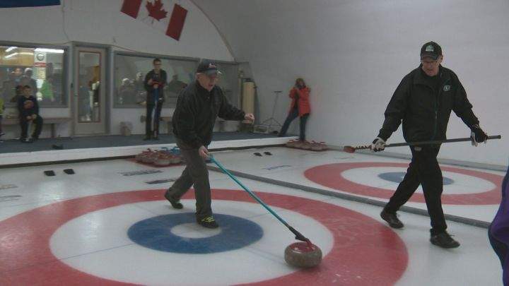 Gord Pennycook looks on as Don Manning throws a rock at the Lougheed Curling Club on Feb. 3, 2016.