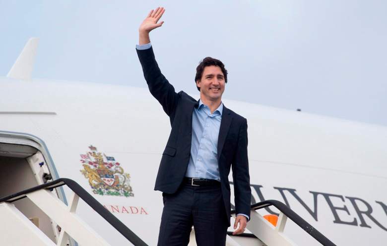Canadian Prime Minister Justin Trudeau as he boards a government plane before leaving the United Kingdom Thursday November 26, 2015 in Luton, England. Trudeau is heading to Malta for the Commonwealths Heads of Government meeting.