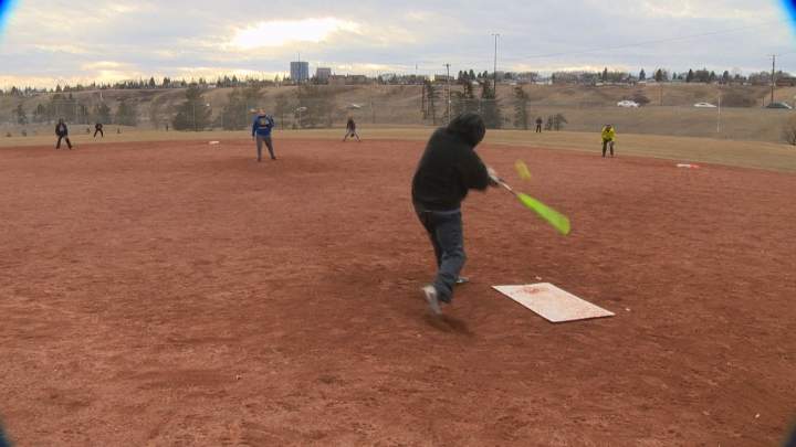 Calgarians play a little pick-up softball Feb. 28.