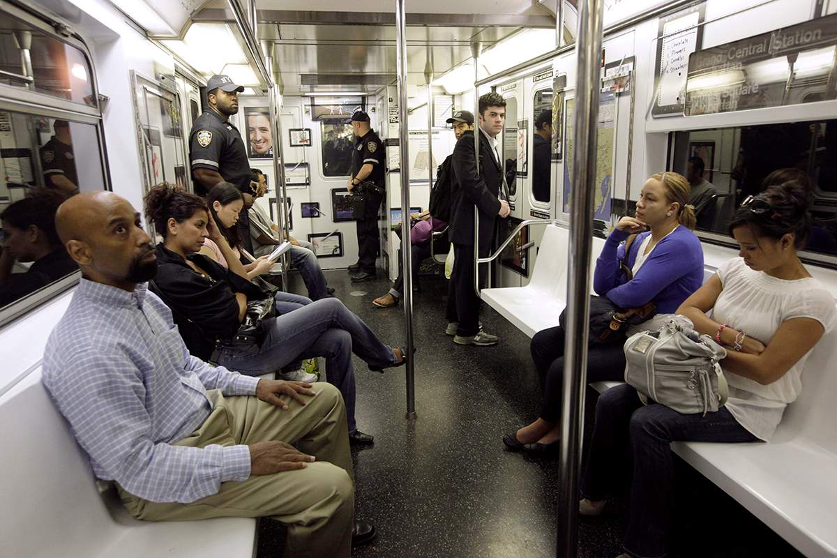 In this Sept. 11, 2011 file photo, people ride a New York City subway train. Researchers from Weill Cornell and scientists at the American Museum of Natural History have traced bedbugs through the city's subway system and discovered a genetic diversity among the bloodsucking creatures. 