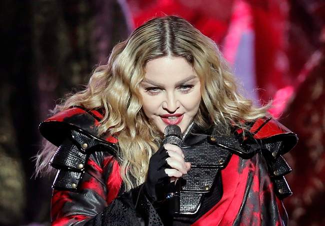 FILE - In this Feb. 20, 2016 file photo, U.S. singer Madonna performs during the Rebel Heart World Tour in Macau.
