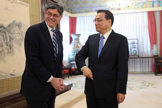 U.S. Secretary of the Treasury Jacob Lew, left, reets Chinese Premier Li Keqiang ahead of a meeting in Zhongnanhai Leadership Compound in Beijing, China, Monday, Feb. 29, 2016.