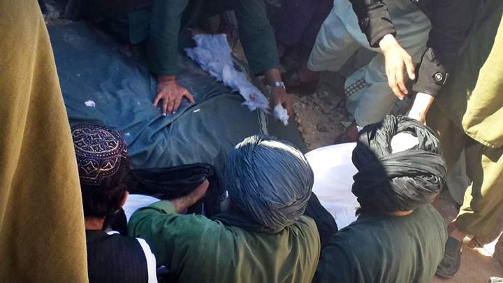 Relatives of an Afghan boy, lay his body in the grave during his funeral procession, in Uruzgan province, of Afghanistan, Wednesday, Feb. 3, 2016. A 10-year-old Afghan boy who was declared a hero after fighting the Taliban has been shot dead by insurgents while on his way to school. The use of child soldiers is illegal in Afghanistan, but the charity Child Soldiers International says both government forces and insurgents have been recruiting minors for years. (AP Photo).
