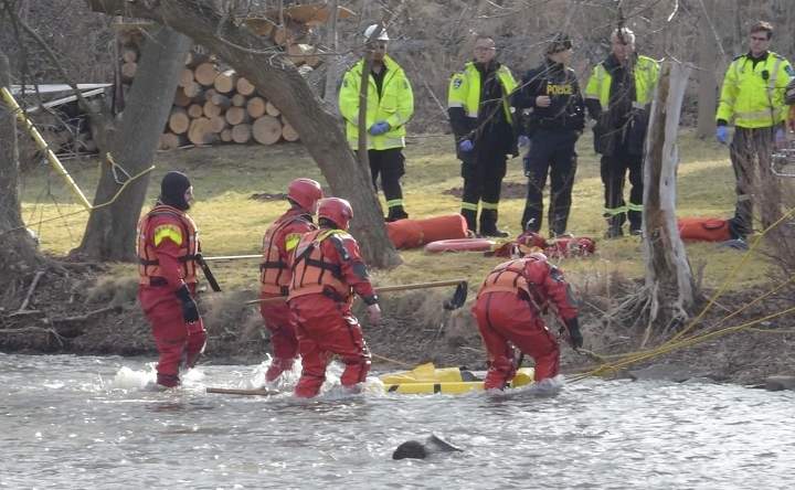 First responders attend the scene at the Credit River in Caledon, Ont., after one kayaker was declared dead and a second missing.