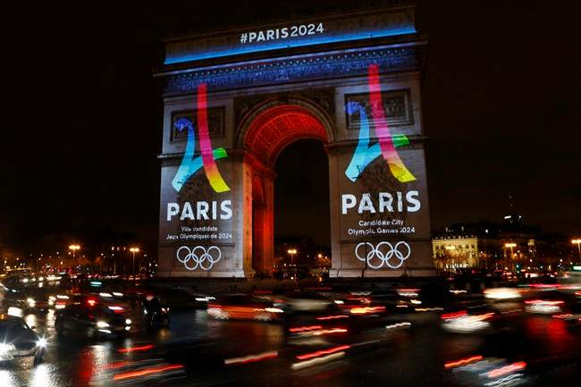 The Eiffel Tower-shaped bid logo for the Paris 2024 is unveiled on The Arc of Triomphe on the Champs Elysees in Paris, France, Tuesday, Feb. 9, 2016. 