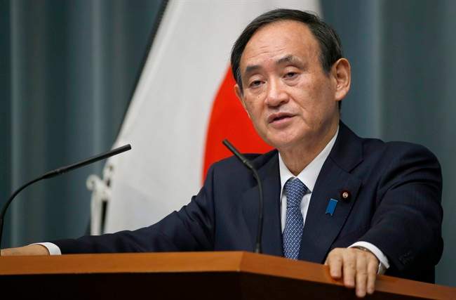 Japan's Chief Cabinet Secretary Yoshihide Suga speaks to the media during a press conference at Prime Minister's official residence in Tokyo, Wednesday, Feb. 10, 2016.