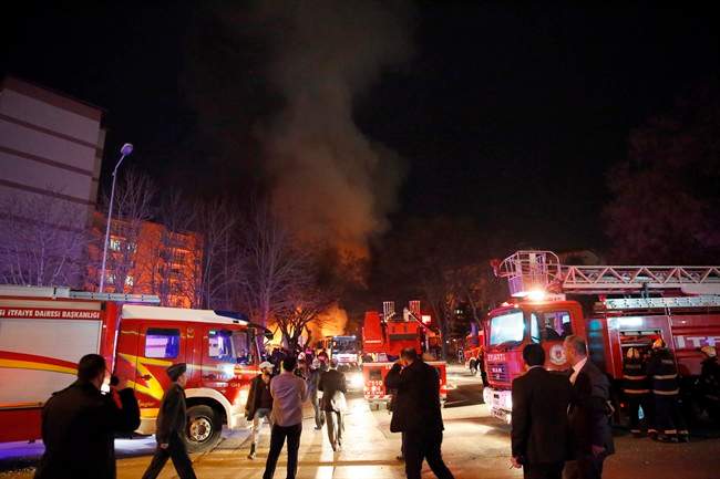 Smoke from a fire billows following an explosion as police and rescue services work on the area in Ankara, Wednesday, Feb. 17, 2016.(Cihan News Agency via AP).