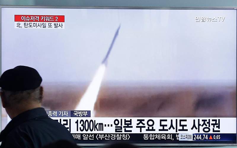A man watches a TV screen showing a file footage of the missile launch conducted by North Korea, at Seoul Railway Station in Seoul, South Korea, Friday, March 18, 2016.  