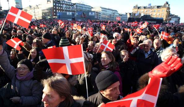 Crowds waving Danish flags gather during the official reception to celebrate Queen Margarethe II of Denmark's 40 years on the throne at City Hall on January 14, 2012 in Copenhagen, Denmark. (Photo by Chris Jackson/WireImage).