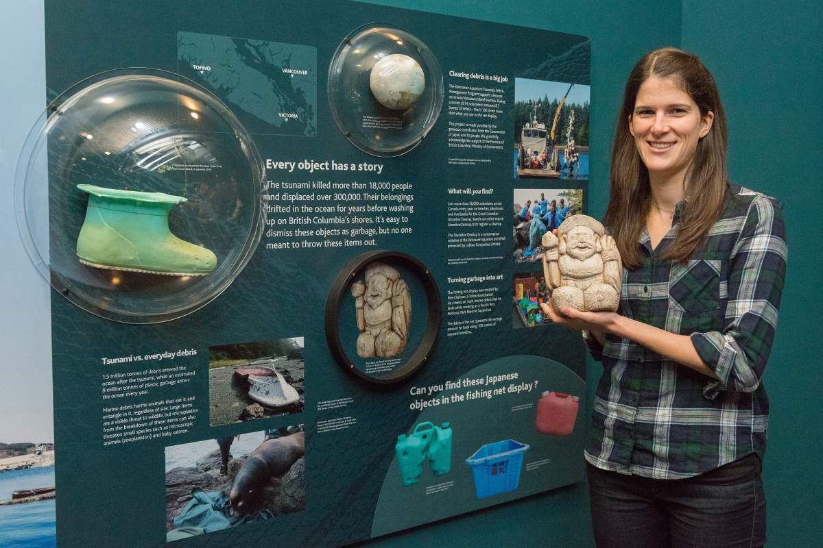 Vancouver Aquarium’s Kate Le Souef with a wooden statue recovered on a beach in Ucluelet in 2013.