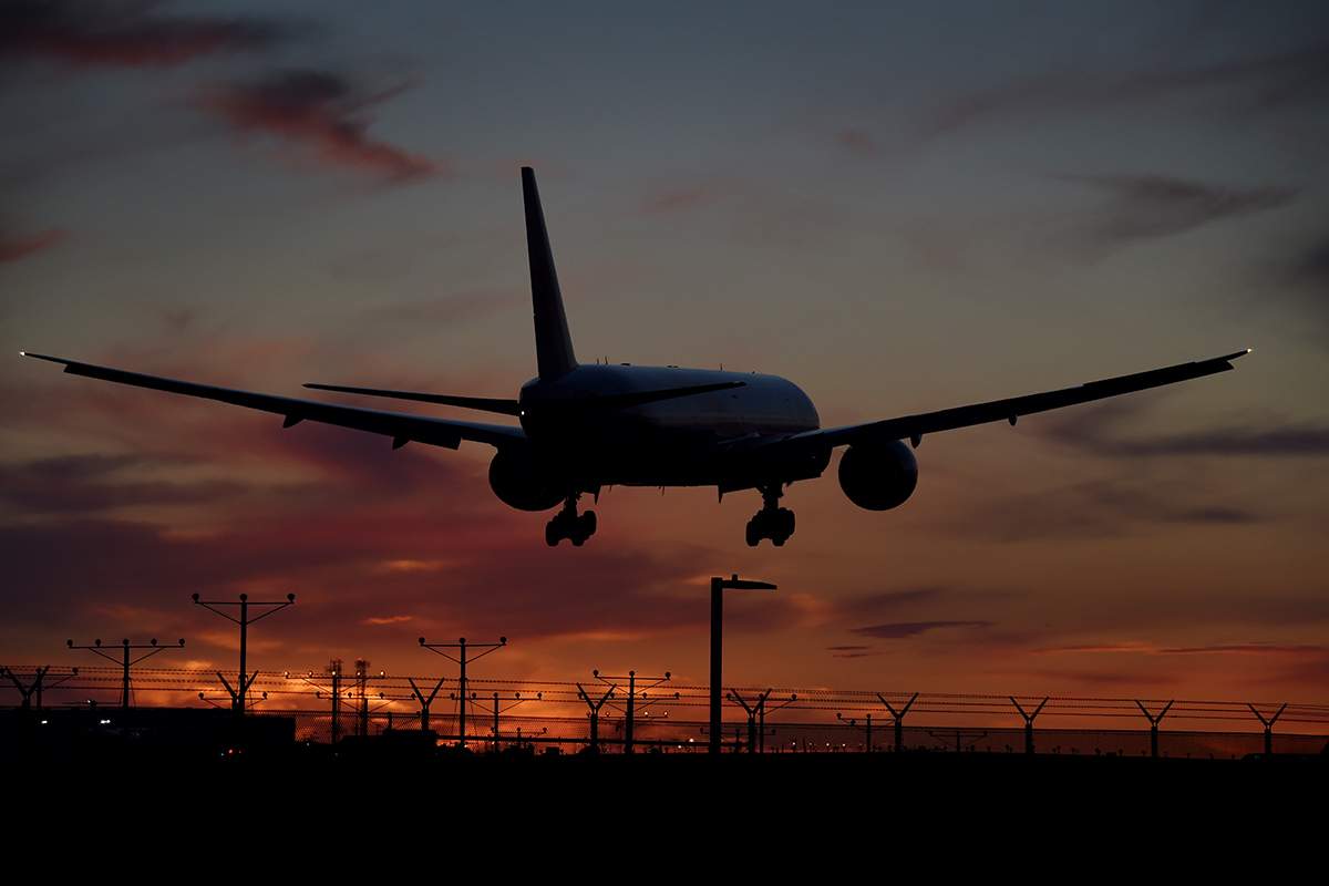 FILE: An Air China plane makes its descent over the city of Inglewood as it prepares to land at Los Angeles International Airport.