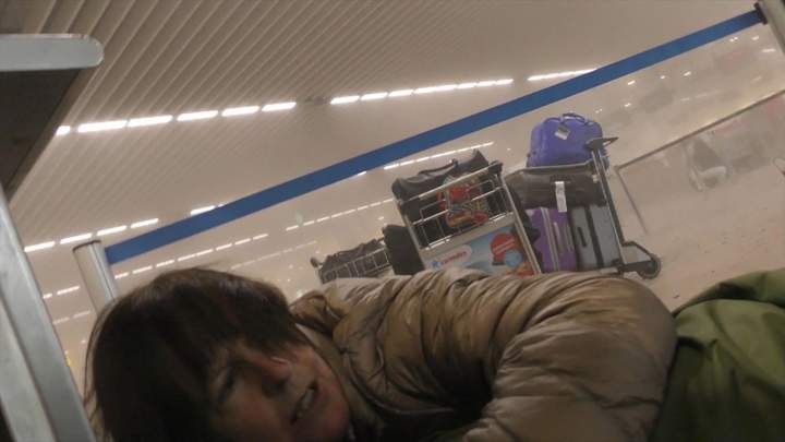 An unidentified traveller lies on the ground in a smoke-filled terminal at Brussels Airport, Belgium.