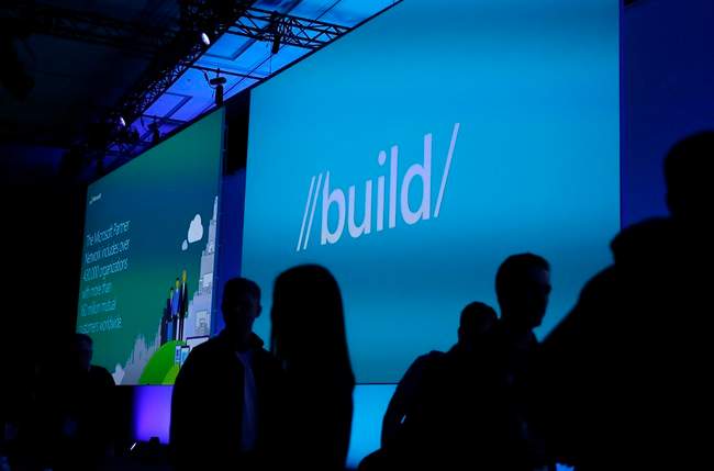 People make their way to their seats for the start of the keynote address of the Microsoft Build Conference, Wednesday, March 30, 2016, in San Francisco. 