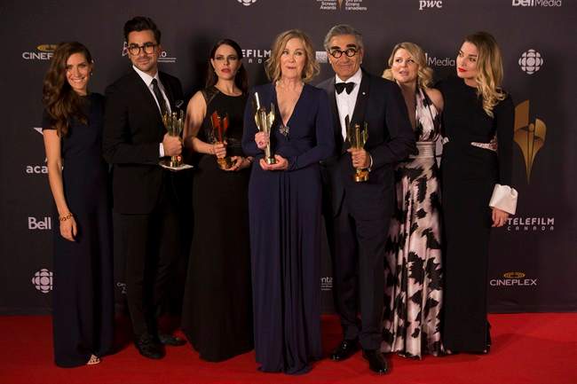 Cast members from 'Schists Creek' hold their multiple awards at the Canadian Screen Awards in Toronto on Sunday evening, March 13, 2016. THE CANADIAN PRESS/Chris Young.