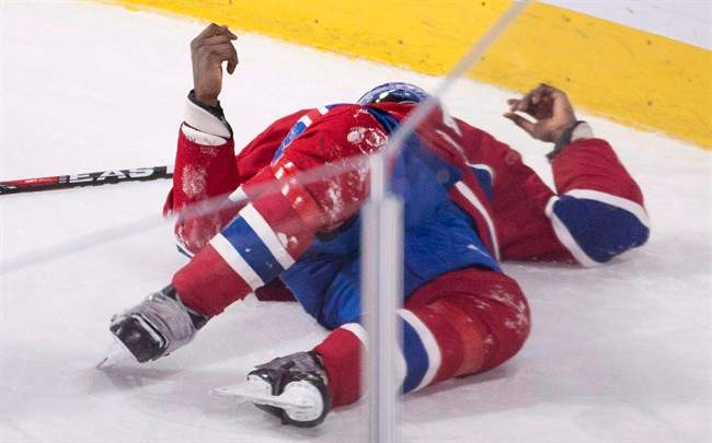 Montreal Canadiens' P.K. Subban lies injured on the ice during third period NHL hockey action against the Buffalo Sabres in Montreal, Thursday, March 10, 2016.