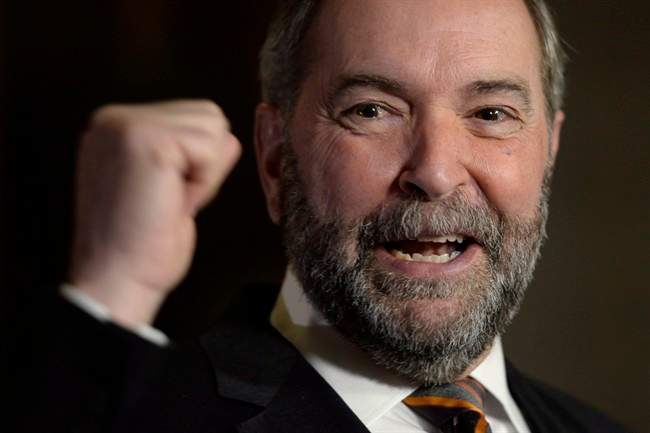 NDP Leader Tom Mulcair speaks to reporters in the Foyer of the House of Commons in Ottawa on Wednesday, Dec. 2, 2015. 