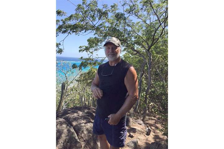In this March 6, 2015 photo provided by Donna Thompson, shows her husband David Thompson at Virgen Gorda, British Virgin Islands.