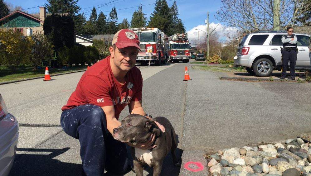 Burnaby firefighter Dillon Peters with Caddy.