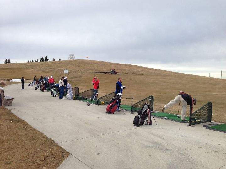 Golfers take advantage of an unusually warm March day to hit some balls at the Mill Woods Golf Club's driving range on Saturday, March 12, 2016.