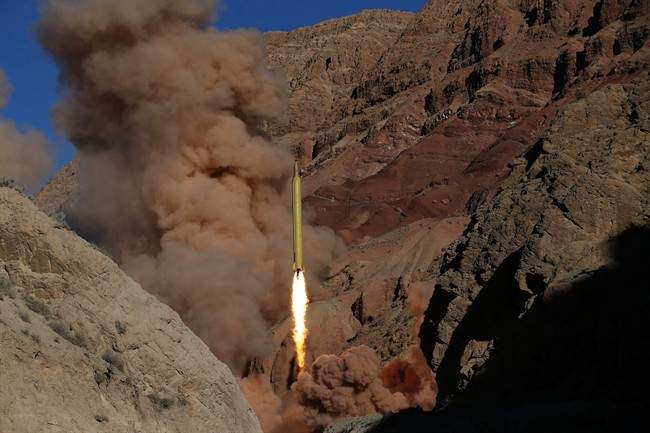 In this photo obtained from the Iranian Fars News Agency, a Qadr H long-range ballistic surface-to-surface missile is fired by Iran’s powerful Revolutionary Guard, during a maneuver, in an undisclosed location in Iran, Wednesday, March 9, 2016. Iran’s powerful Revolutionary Guard test-fired two ballistic missiles Wednesday with the phrase “Israel must be wiped out\” written on them, a show of deterrence power by the Islamic Republic as U.S. Vice President Joe Biden visited Israel, the semi-official Fars news agency reported.