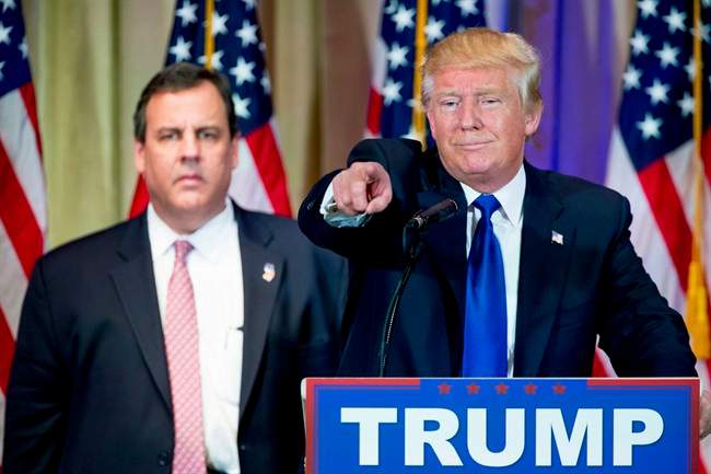 Republican presidential candidate Donald Trump, accompanied by New Jersey Gov. Chris Christie, left, takes questions from members of the media during a news conference on Super Tuesday primary election night in the White and Gold Ballroom at The Mar-A-Lago Club in Palm Beach, Fla., Tuesday, March 1, 2016.