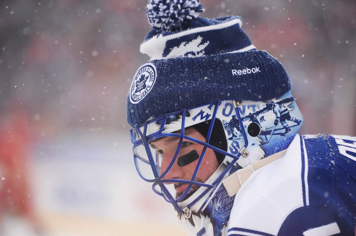 Goaltender Jonathan Bernier of the Toronto Maple Leafs defends the net against the Detroit Red Wings during the 2014 Bridgestone NHL Winter Classic on January 1, 2014 at Michigan Stadium in Ann Arbor, Michigan. 
