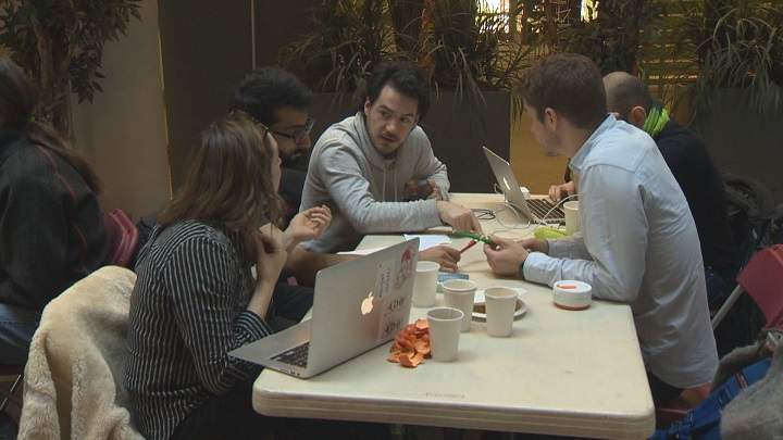 A team of hackers discusses ways to reduce fossil fuel consumption in Montreal. Sunday, March 20, 2016.