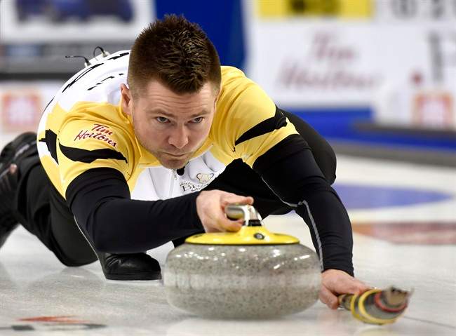 Manitoba skip Mike McEwen makes a shot during a draw against Ontario at the 2016 Tim Hortons Brier.